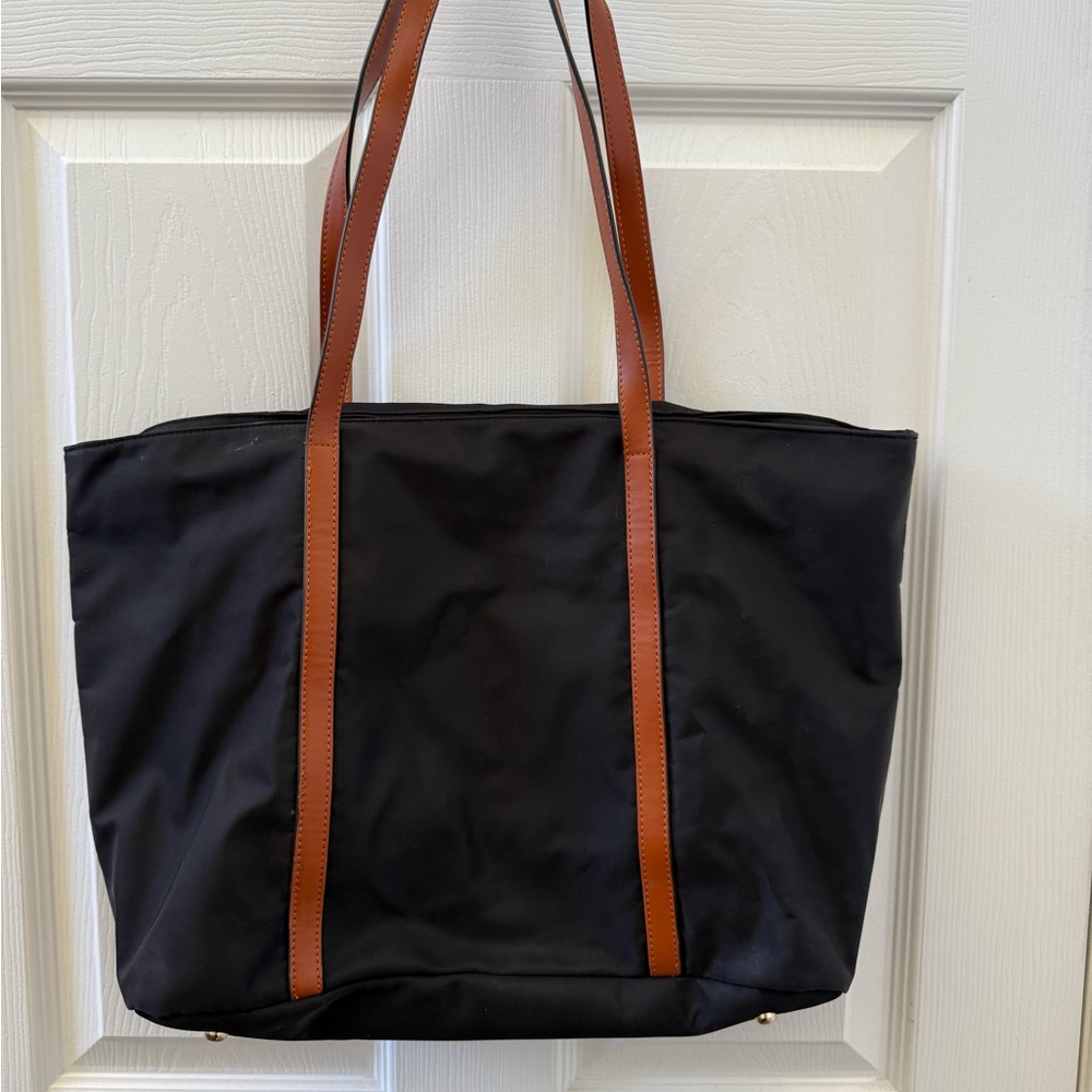 Stylish Black Tote Bag with Brown Straps